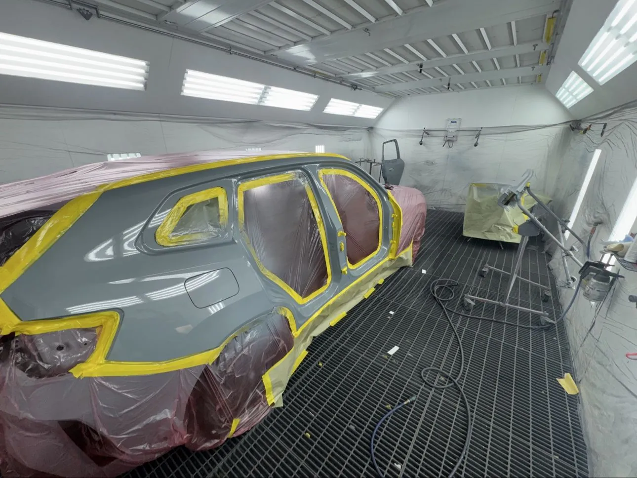 Freshly painted vehicle in Crown Auto Body's professional spray booth