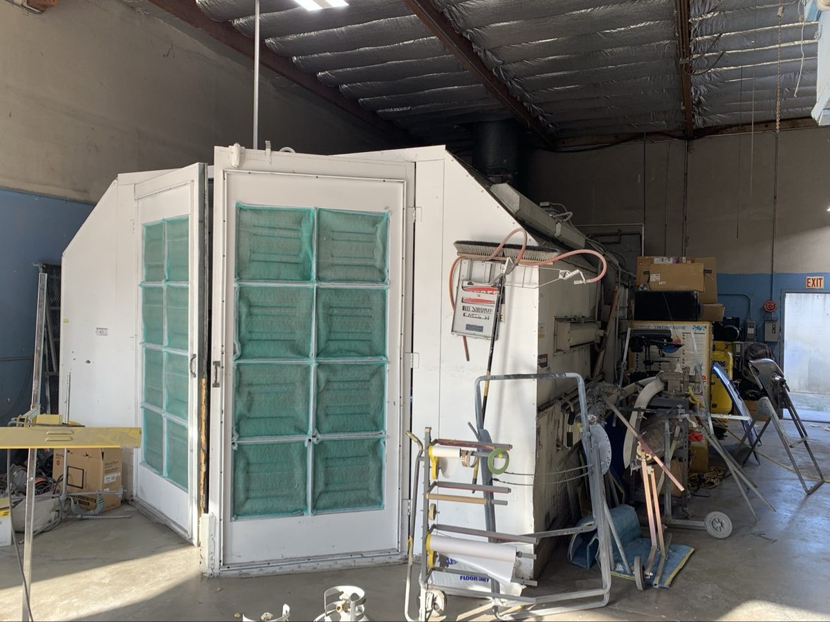 Old worn-out spray booth at Crown Auto Body before upgrade