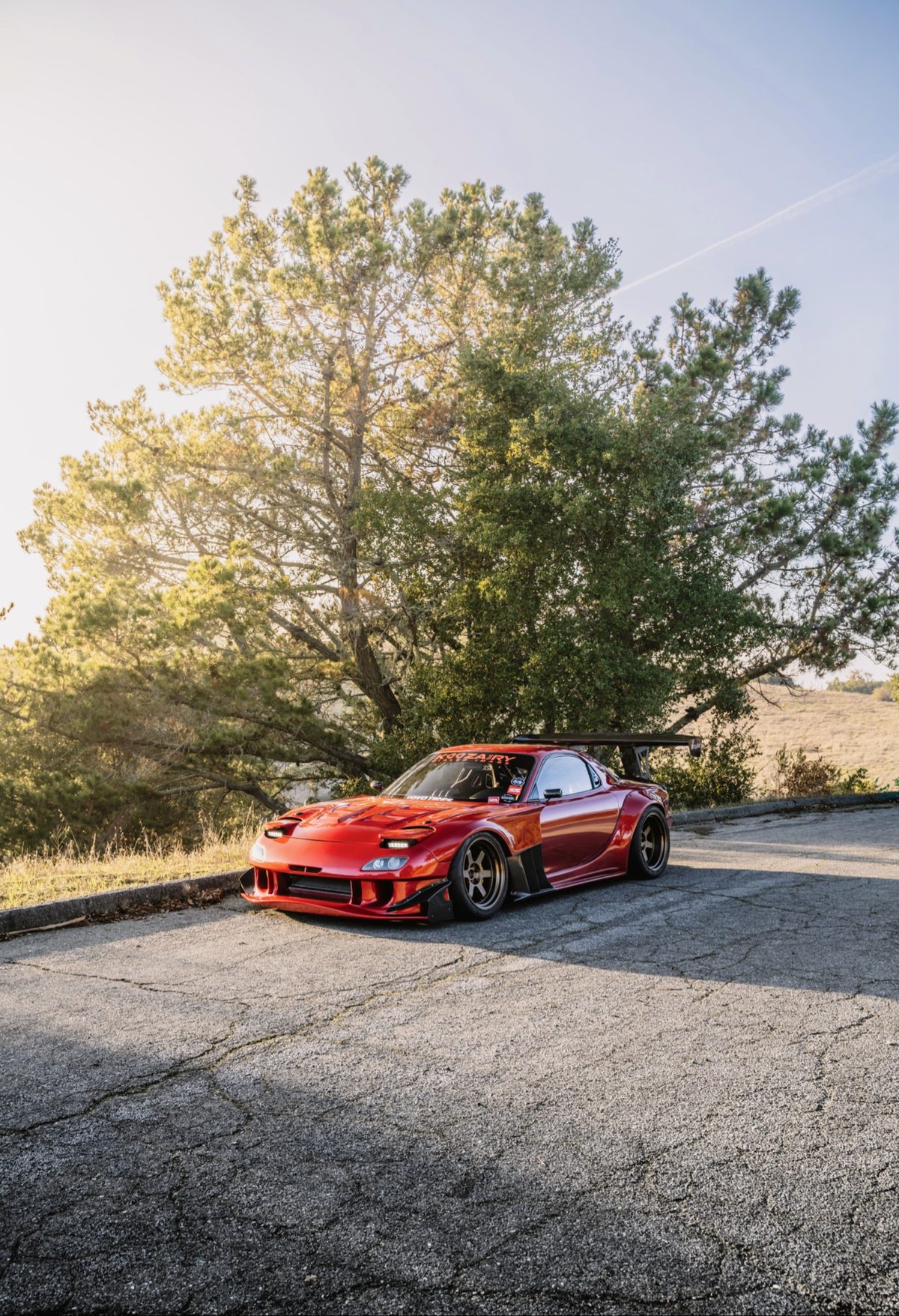 Mazda RX-7 widebody front view after transformation at Crown Auto Body